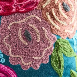 Coussin Lotte, vert avec motif floral coloré